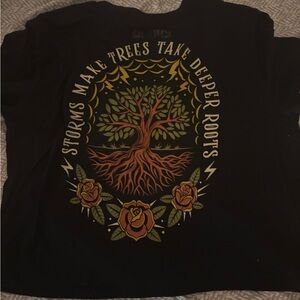 Black Graphic Tee with Tree & Roses - "Storms Make Trees Take Deeper Roots"